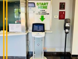 Self-service check-in kiosk inside the Arizona Department of Public Safety (AZDPS) Public Service Center in Phoenix where visitors obtain a ticket before speaking with the Concealed Carry Weapons Permit (CWPU) Unit.